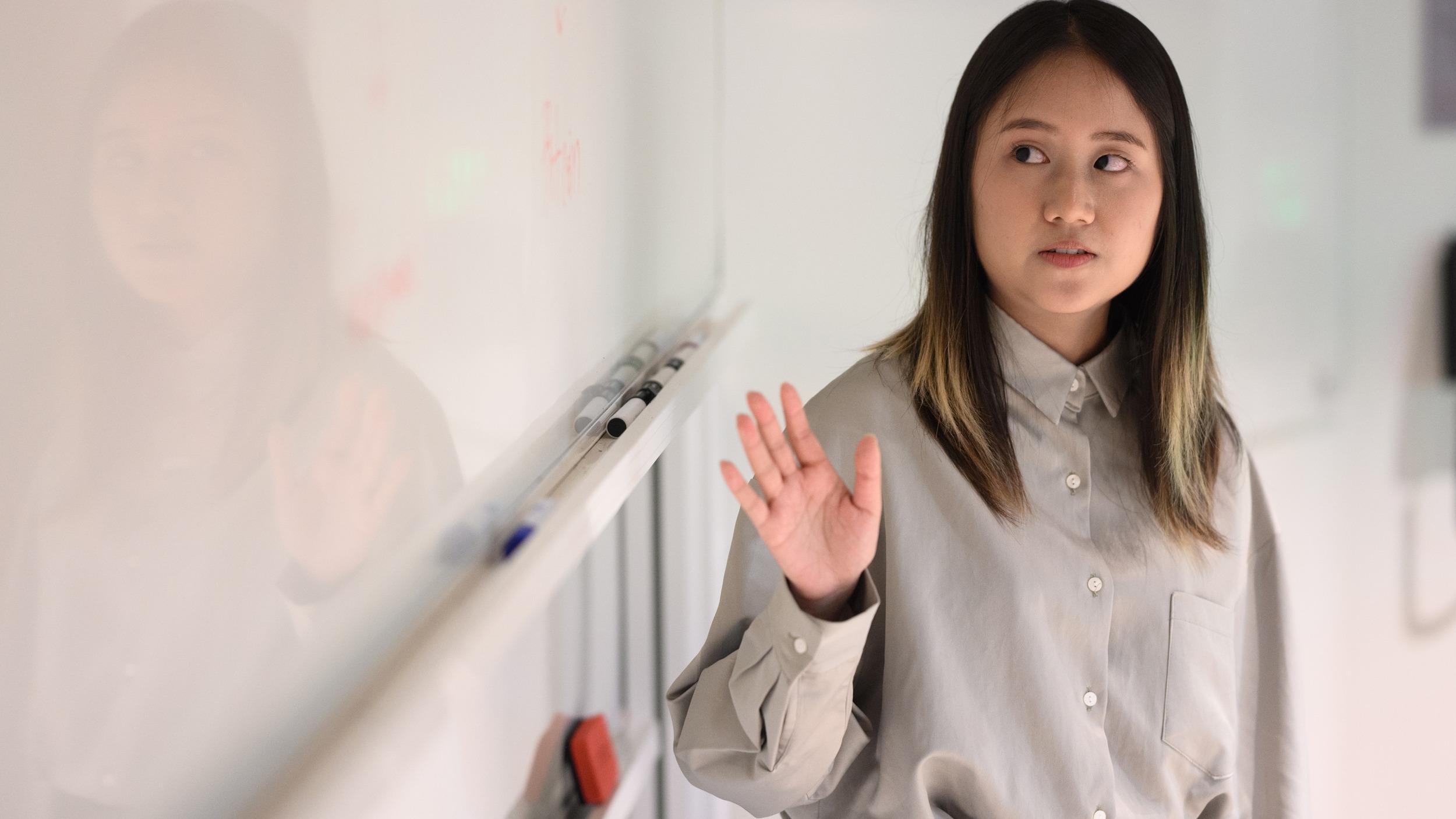 DoM student at whiteboard 747x420